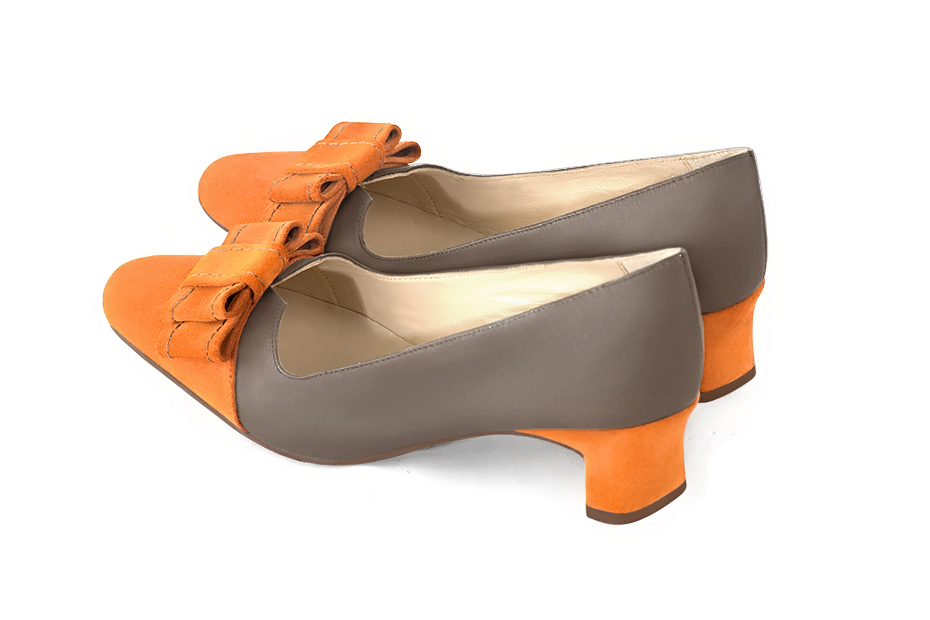 French elegance and refinement for these apricot orange and taupe brown dress pumps, with a knot on the front, 
                available in many subtle leather and colour combinations. Possibility to customize with your colors, materials and heels.
With its original cutout, this pretty fitted pump
will render you great services, combining comfort and distinction. 
                Matching clutches for parties, ceremonies and weddings.   
                You can customize these shoes to perfectly match your tastes or needs, and have a unique model.  
                Choice of leathers, colours, knots and heels. 
                Wide range of materials and shades carefully chosen.  
                Rich collection of flat, low, mid and high heels.  
                Small and large shoe sizes - Florence KOOIJMAN